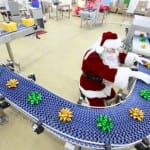 Santa Claus working in Christmas Gifts Factory
